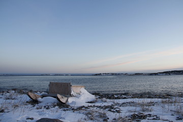 Traditional Inuit cargo sled or Komatik with a box on top and covered in snow, in the Kivalliq...