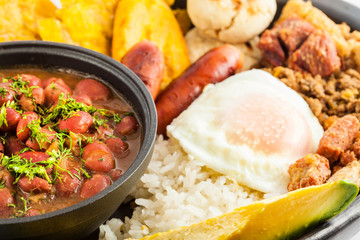 Traditional Colombian dish called Banda paisa: a plate typical of Medellin that includes meat, beans, egg and plantain