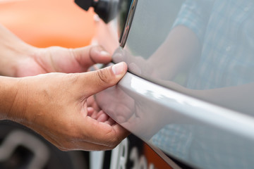 Close up hand open SUV car trunk