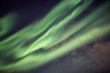 Beautiful green Northern lights, Aurora borealis explosion with starry