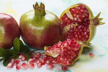 Ripe pomegranate fruit, opened with red seeds