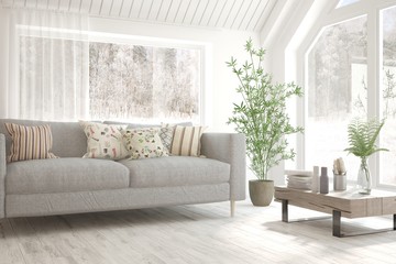 White stylish minimalist room with sofa and winter landscape in window. Scandinavian interior design. 3D illustration
