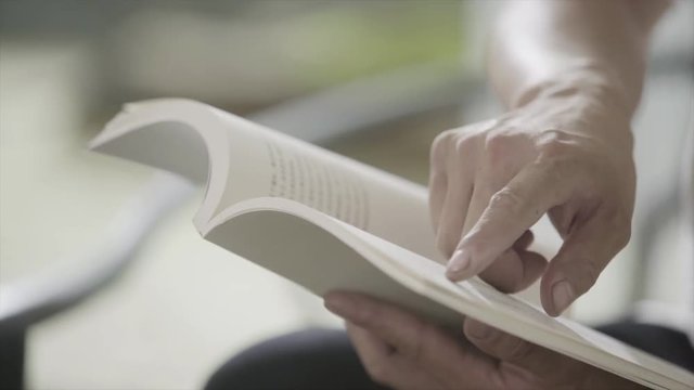 Read Chinese books. Close-up shot.