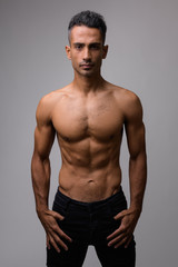Portrait of young muscular Persian man shirtless