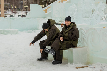 Two workers at the site of the ice camp