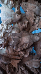 Hindu and Buddhist wooden carving. souvenir shop selling souvenirs and handicrafts of Bali at famous Ubud Market, Indonesia