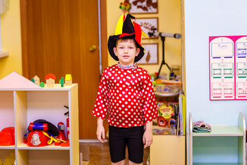 the boy in the fancy suit in kindergarten