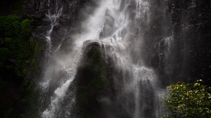 waterfall in green rainforest. triple tropical waterfall Sekumpul in mountain jungle. Bali,Indonesia. Travel concept. Aerial footage.