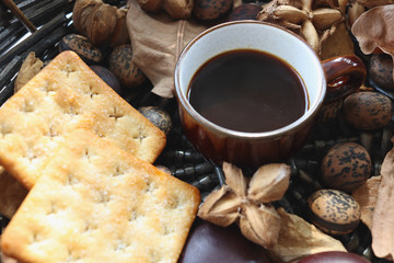 Black coffee with cracker in the basket.