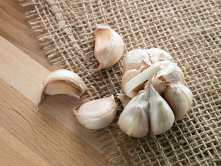 Fresh garlic,  rustic style, wooden background