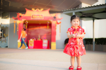 Girl in red Chinese dress.