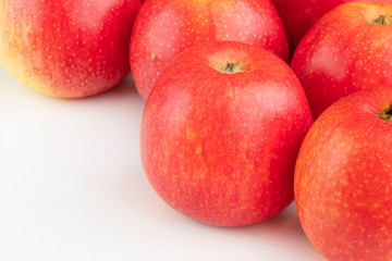 Red apples on the white table