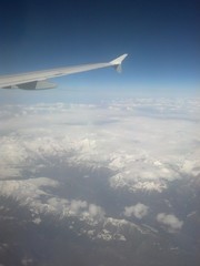 Fototapeta na wymiar snowcapped mountains from the airplane