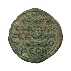 Ancient copper or bronze byzantine coin isolated on white