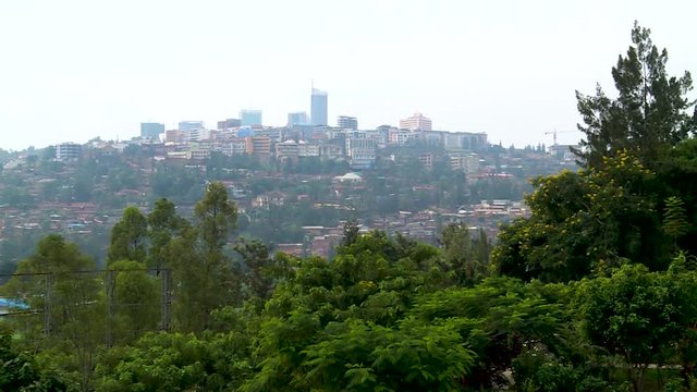 Slow zoom-in on Kigali downtown modern buildings skyline from the hills  - Rwanda.