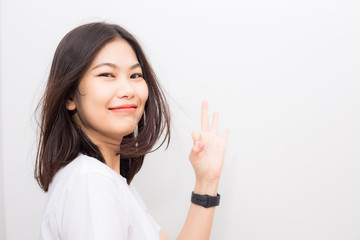 Smiling asian women with smart watch sitting on white background