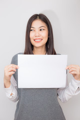 Fototapeta premium Business young asian women holding blank bill board a4 paper