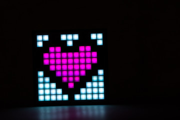 Heart closeup on a black background. Valentine's Day.