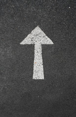 arrow marking sign on a road