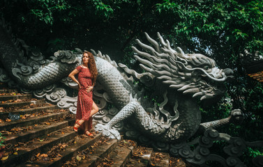 Fototapeta premium girl, dragon, background, stone, beautiful, young, art, woman, blue, black, decoration, old, travel, landscape, tree, outdoor, architecture, grass, building, traditional, house, garden, tourism, cultu