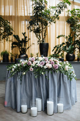 Amazing banquet in gray colors for wedding day with pink flowers