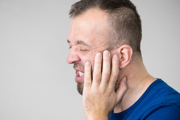 Obraz premium Man having tooth pain