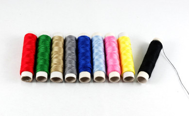 beautiful isolated of concept colorful roll of threads red green blue yellow pink black gold and silver colors, set of colorful thread white background