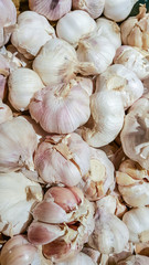 Dried garlic in the tray waiting for cooking in the kitchen.