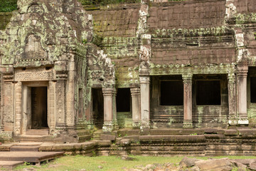 Temple colonnade covered with lichen by doorway