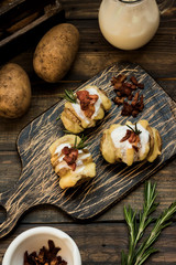 Baked potato with bacon and fresh yogurt