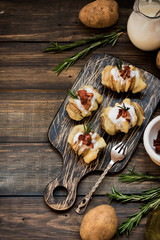 Baked potato with bacon and fresh yogurt