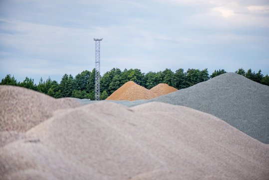 Large Piles Of Construction Sand And Gravel Used For Asphalt Production And Building. Limestone Quarry, Mining Rocks And Stones 