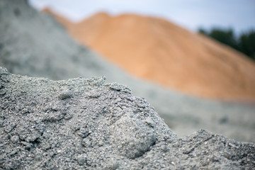 Large piles of construction sand and gravel used for asphalt production and building. Limestone...