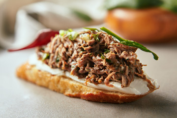 italian bruschetta with cream cheese and aromatic beef