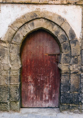 Fototapeta na wymiar Old arabic door in Morocco (Marrakesh). Traditional oriental style and design in Muslim countries