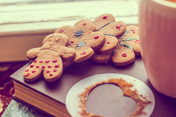 Gingerbread cookie on a sweater. Tasty flour product. Food
