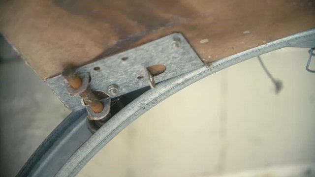 Slow motion Insert: Garage door slider / wheel roller mechanisms roll closed