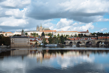 Cityscape of Prague and Vltava river with reflections