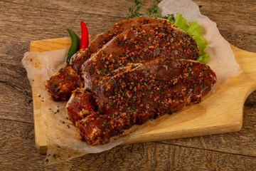 Raw marinated pork steak