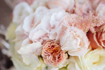 Wedding flowers, bridal bouquet closeup. Decoration made of roses, peonies and decorative plants, close-up, selective focus, nobody, objects
