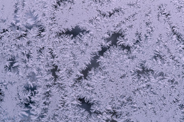 On the glass frozen moisture in the winter day formed a beautiful, fantastic patterns, unpredictable compositions, instagram.