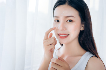 Beauty Asian Woman use Acne Gel Skincare after Cleansing on Face His Happiness,Copy Space.