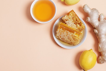 Honey, lemon and ginger on a pink background