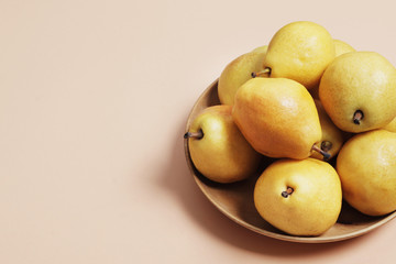 Sweet yellow pears on a pink background. Design. Stylish pears. 3d pears