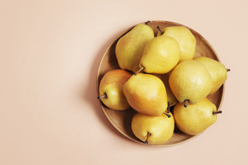 Sweet yellow pears on a pink background. Design. Stylish pears. 3d pears.