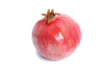 Ripe red pomegranate cut on a white background isolated.