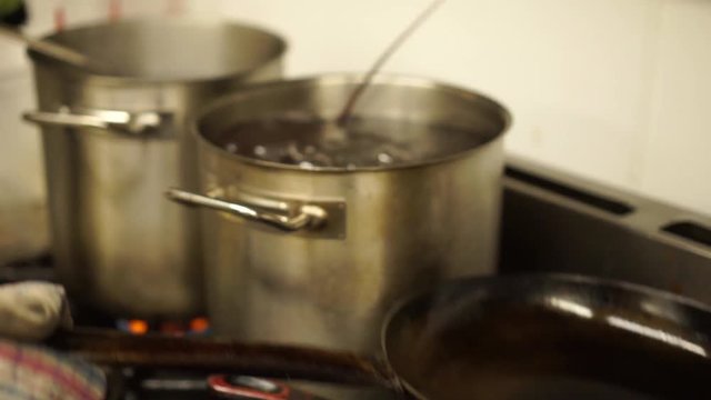 Putting A New Zealand Fresh Crayfish In A Pot Of Hot Water To Boil