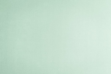 Cotton silk blended fabric wallpaper texture pattern background in light pale pastel green color