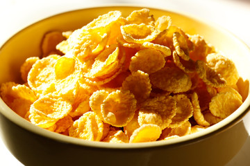 Healthy breakfast. Cornflakes in a bowl on a wooden table. Place for text. Top view.