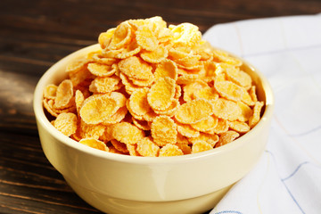 Healthy breakfast. Cornflakes in a bowl on a wooden table. Place for text. Top view.